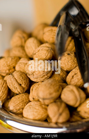 Walnuts with nutcracker Stock Photo