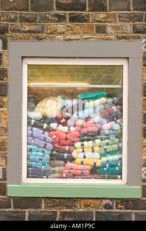 balls of wool in a house window in Burnley Lancashire Stock Photo