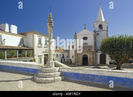 Portugal Estremadura region, Costa da Prata, Obidos mediaeval walled town the church of Santa Maria and the manueline pillory Stock Photo