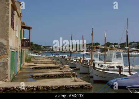 Fishing boats and old docks in Cala Llonga east coast of Mallorca Spain Stock Photo