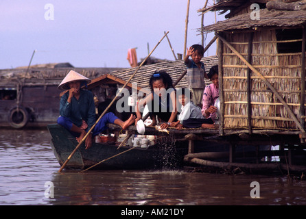 Vietnamese people living in a floating village. Tonle Sap, Cambodia. Stock Photo