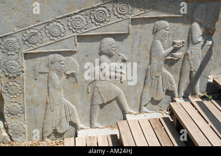 Slaves and soldiers carry gifts for Persian Emperor in Darius palace stairs PERSEPOLIS Iran Stock Photo