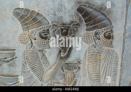 Slaves and soldiers carry gifts for Persian Emperor in Xerxes palace PERSEPOLIS Iran Stock Photo