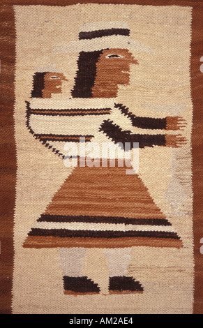 Woven woollen rug in earthy hues depicting an indigenous woman with a child on her back Otavalo Ecuador Stock Photo