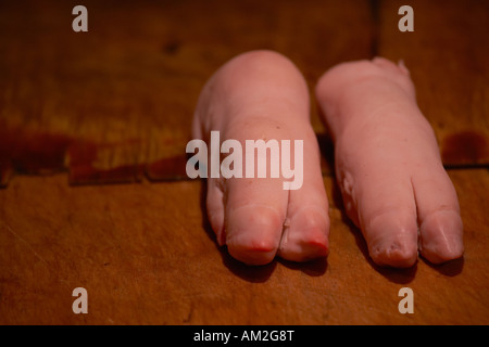 Pig trotters on sale in hutong market Beijing China Stock Photo