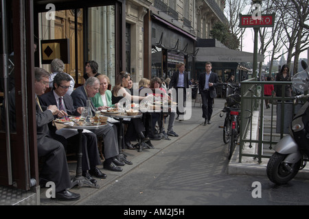 office workers having lunch at restaurant in the business district of Paris Stock Photo