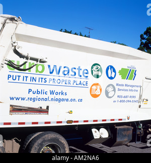 Curb side waste collection sign on the side of a Canadian Niagara region bin lorry garbage truck Fort Erie Ontario Canada North America  KATHY DEWITT Stock Photo
