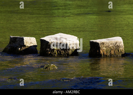 3 stepping stones in river dovedale peak district national park uk Stock Photo