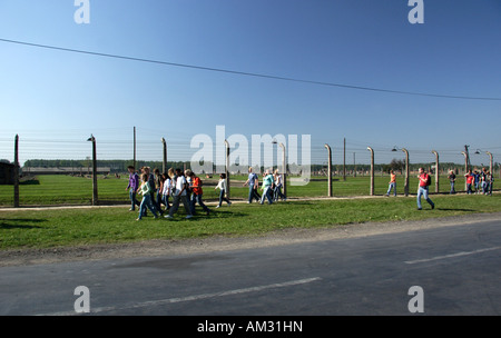 School children leave Birkenau, Auschwitz II following an educational visit to the former Nazi death camp at Oswiecim, Poland. Stock Photo