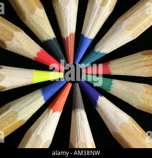 Coloured pencils laid out on black background in studio Stock Photo