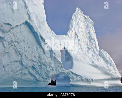 A large iceberg lodged in the bottom of Maxwell Bay in 450 feet of water off King George Island Antarctica Stock Photo