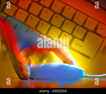Hand and computer mouse with keyboard in background Stock Photo