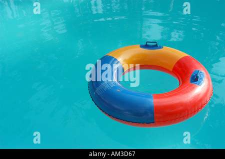 Rubber ring floating in a swimming pool Stock Photo