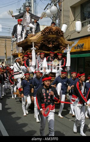 Young Japanese men riding a dangerous festival float at the Otori Danjiri Festival in Osaka Kansai Japan Asia Stock Photo