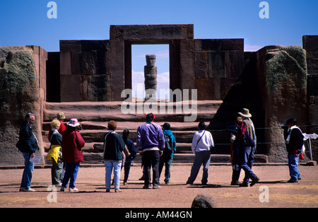 Tourist at Kalassasaya Temple entrance and Ponce Monolith. Tiahuanaco ruins , Bolivia Stock Photo