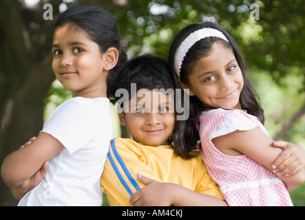 Portrait of two girls and a boy standing together Stock Photo - Alamy