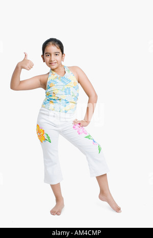 Portrait of a girl showing a thumbs up sign Stock Photo - Alamy
