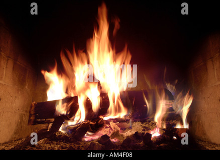 roaring fire in the fireplace Stock Photo