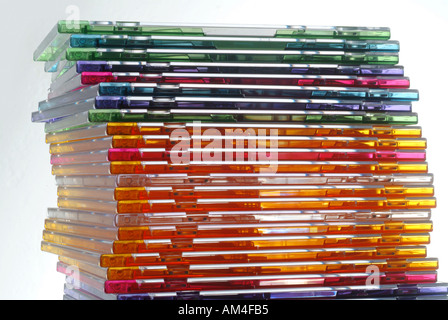 Colored CDs and jewel boxes stacked high Stock Photo