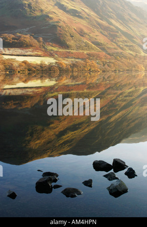 A Fell Reflected in a lake in Autumn. England UK Stock Photo