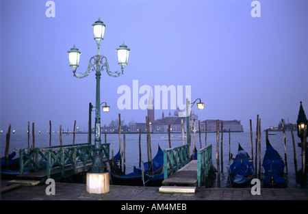 Piazza San Marco and Isola San Giorgio Maggiore, Venice - view of moored gondolas at night Stock Photo