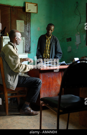 Two Ethiopian members of Afeta Wanja coffee growers cooperative working in their office, Ethiopia Stock Photo