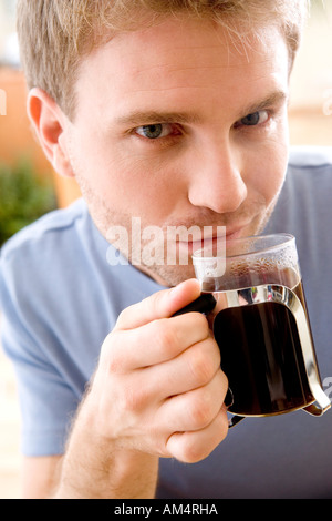 man drinking black coffee Stock Photo