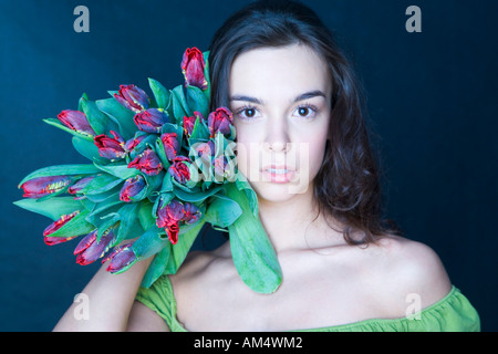 young woman with banch of tulips Stock Photo