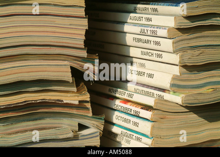 stack of magazines bound with string and ready to be put out for recycling. Stock Photo