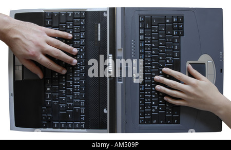 Two hands typing on laptop keyboards, topview, cut out Stock Photo