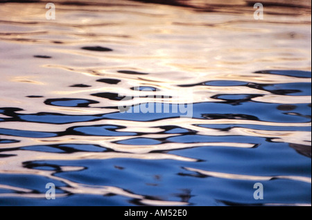 Colorful reflections on smooth water Stock Photo