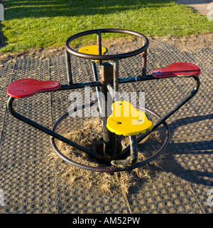 round about swing in empty playground Stock Photo