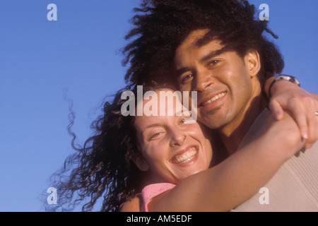 portrait of couple laughing 34 yr old mixed African Caucasian male and 27 yr old Caucasian female Stock Photo