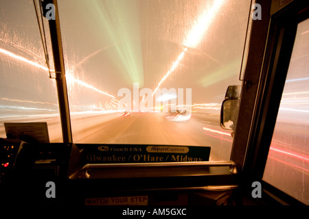 Bus ride in a heavy snow storm. Looking through the windscreen. Near Chicago O'Hare. Stock Photo