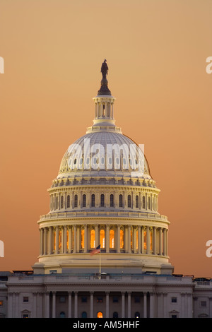 Dome and west front columns of the US Capitol building in Washington DC at dawn in warm early morning light. View from The Mall. Stock Photo