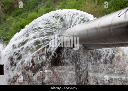 Water leak. Leaking pipes. Burst water pipes leaking drinking water, near Almaty Kazakhstan Stock Photo