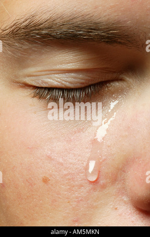 Eye with a teardrop Stock Photo