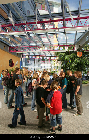 Pupils in the break hall of a modern school, Waldkraiburg, Upper Bavaria, Bavaria, Germany Stock Photo