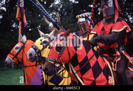 Medieval jousting tournament re enactment knights on horses at Caerlaverock Castle near Dumfries Scotland UK Stock Photo