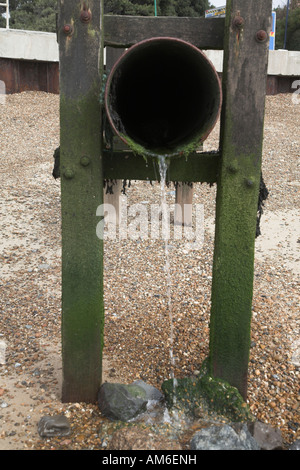 Drain outflow pipe emptying on beach Felixstowe, Suffolk, England Stock Photo