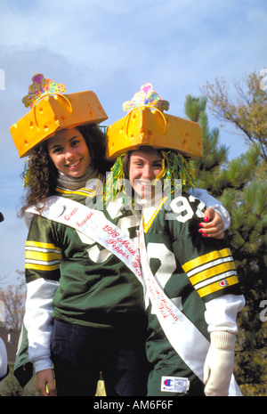 Wisconsin Green Bay Packer teen Cheeseheads age 15 in Anoka Halloween Festival Parade. Anoka Minnesota USA Stock Photo