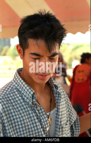 Handsome Asian man age 20 looking thoughtful at Asian American Festival. St Paul Minnesota USA Stock Photo