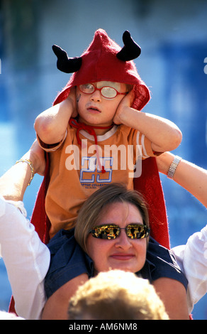 Arboc covering ears during the fireworks of the ball de diables Stock Photo