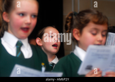Primary school pupils during Christmas carol concert, Waterman's Art Centre, Brentford, Middlesex, UK. 30 November 2007. Stock Photo