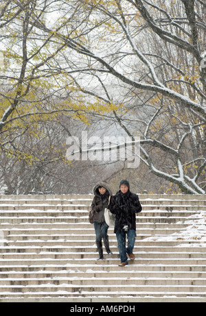 Young couple walking down the stairs at Bethesda Fountain in Central Park Stock Photo