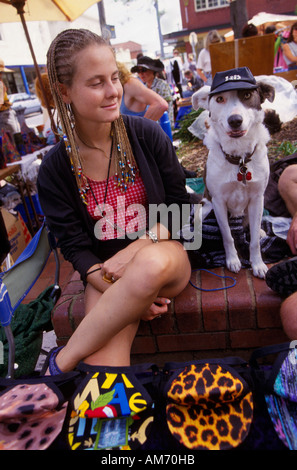 Sunday market trader with dog Greville St., Prahran, Melbourne,  Victoria, Australia, Vertical, Stock Photo