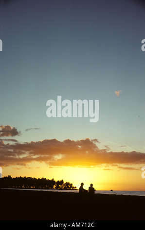 Couple on beach at sunset Nadi, Vitilevu, Fiji Stock Photo