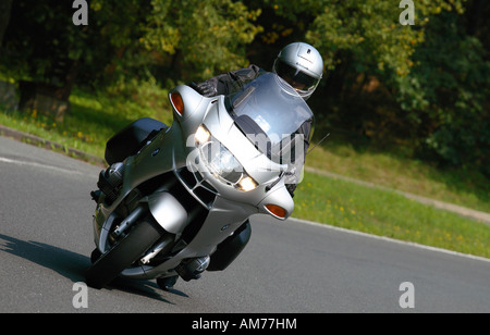 Motorcyclist on a BMW on a bending road Stock Photo