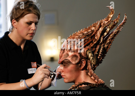 Surrealistic made up young man with mask, bodypainting presentation ... image