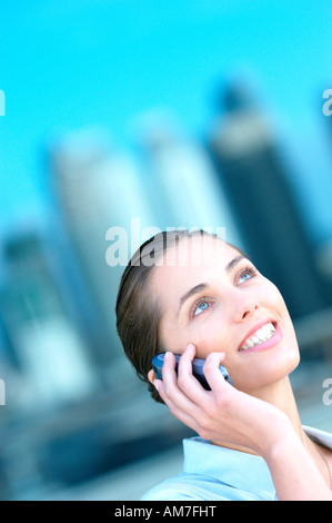 Young businesswoman using mobile phone Stock Photo